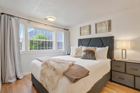 Relax and recharge in this cozy queen bed with soft linens and thoughtful touches.