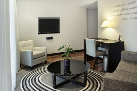 Suite, 1 King Bed | Living area | LCD TV, iPod dock