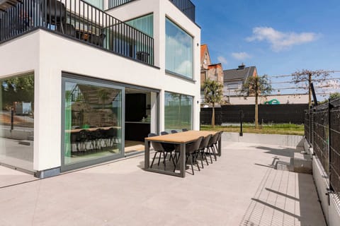 Sunny terrace with elegant outdoor setup.
