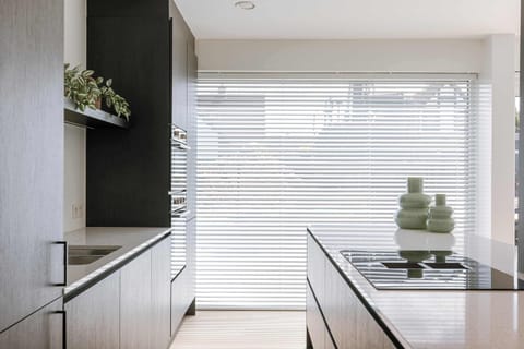 Kitchen with soft contrast — modern, welcoming, refined.