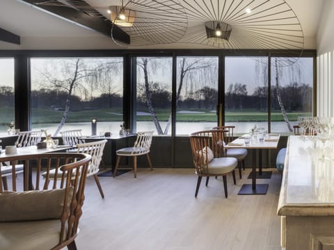 Breakfast, lunch, dinner served; French cuisine, golf course views 