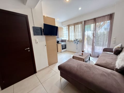 Apartment | Living area | 24-inch flat-screen TV with digital channels