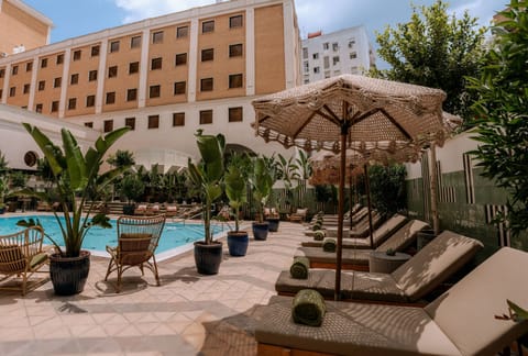 Outdoor pool, open 10:00 AM to 9:00 PM, pool umbrellas, sun loungers