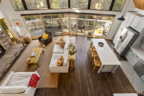 Kitchen opened up to living room with fireplace and TV!
