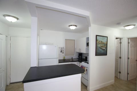 Family Apartment, 1 Bedroom | Private kitchen | Fridge, microwave, stovetop, coffee/tea maker