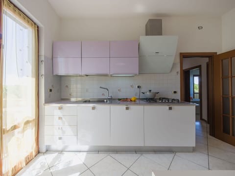 Kitchen, Flooring, Interior Design, Kitchen Appliance, Countertop, Wood, Floor, Cabinetry, Major Appliance, Lighting