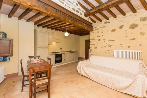 Apartment, 1 Bedroom (Olio) | Living area | Flat-screen TV