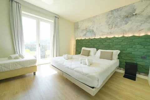 Superior Triple Room, Lake View | Minibar, in-room safe, soundproofing, free WiFi