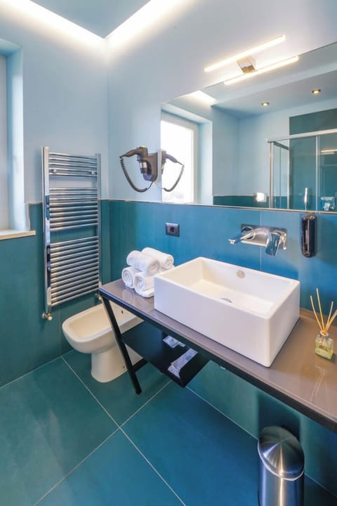 Superior Triple Room, Lake View | Bathroom | Shower, hair dryer, towels, soap