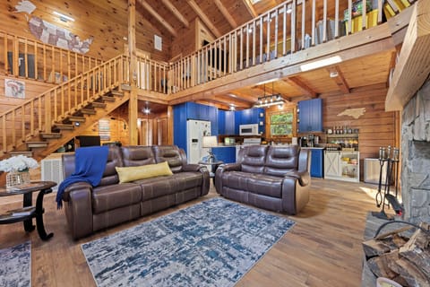 Rustic charm meets comfort—plush seating and a view-filled dining area