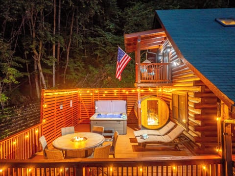Decked out with hot tub, sauna, fire table & twinkle-lit charm