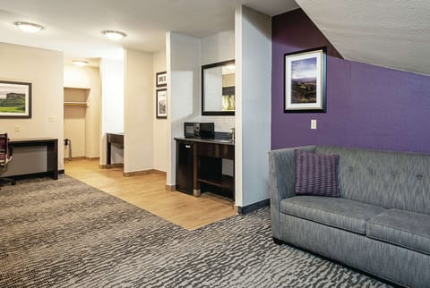 Premium bedding, desk, laptop workspace, blackout drapes