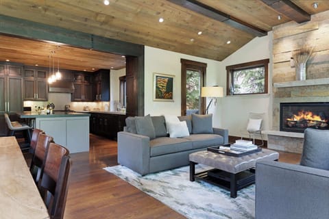 Curl up with a glass of wine by the fireplace in the inviting living room