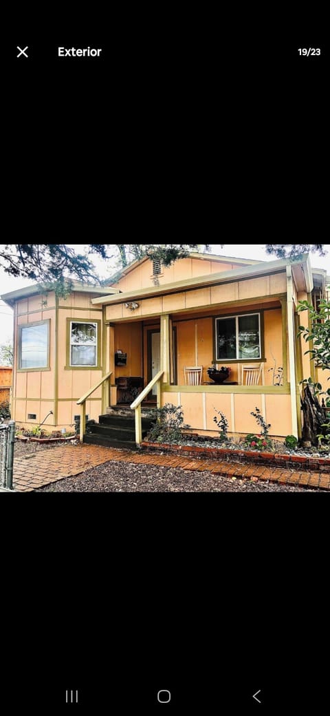 Charming exterior with a covered front porch, ideal for enjoying quite evening.