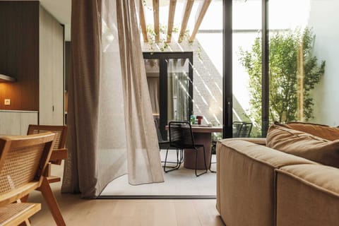 Bright living room with garden access and curtain wall