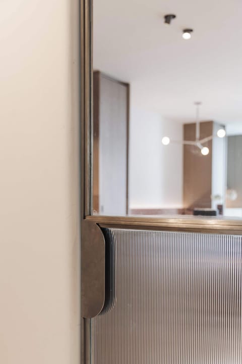 Open-plan kitchen and living view from hallway