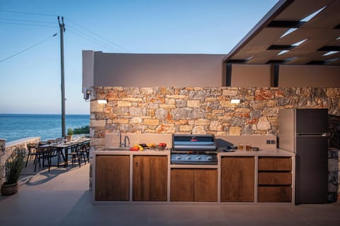 BBQ facilities with BEEFEATER Gas grill, 2 gas hobs, a sink, a refrigerator, ample counter, and storage space.