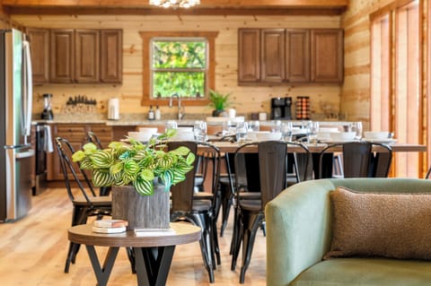 Main living area with plenty of seating, fireplace, and large TV.