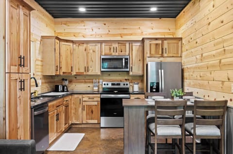 Kitchen: The heart of the home! Our open kitchen and dining area are perfect for gathering, sharing stories, and making memories.