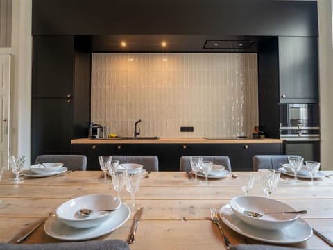 Furniture, Interior Design, Kitchen, Wall, Flooring, Wood, Countertop, Light Fixture, Ceiling, Floor