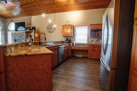 Fully equipped kitchen with granite counters and open layout—perfect for group meals.