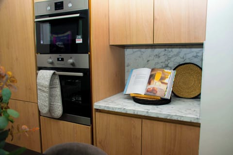 A well-designed, fully equipped kitchen that combines style and functionality for a seamless cooking experience.