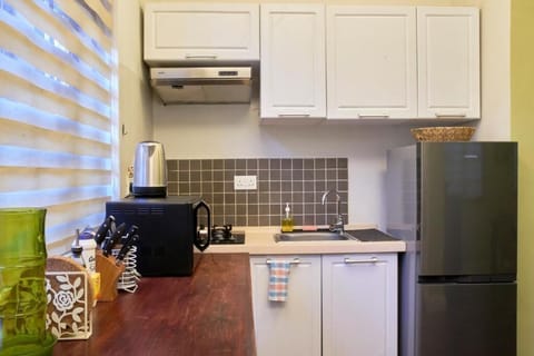 Superior Suite | Private kitchen | Fridge, stovetop, electric kettle, cookware/dishes/utensils