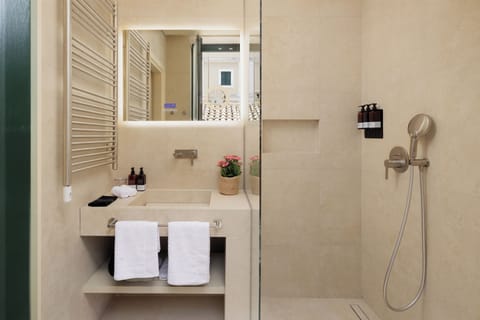 Shower, hair dryer, slippers, towels