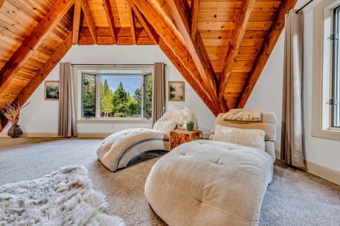 Bedroom 1 (Upstairs Primary): King bed, private balcony, shared bath, kids playroom