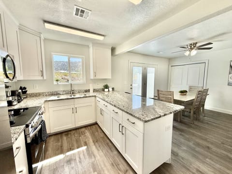 The kitchen offers new appliances (no dishwasher) and plenty of counter space