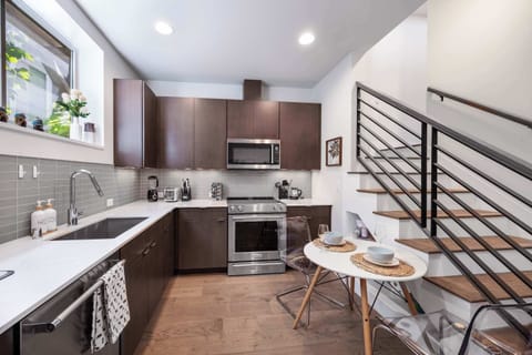 Everything within reach in this well-designed cooking space with dining area.