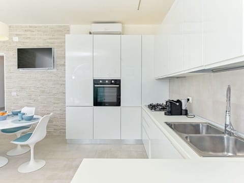 Countertop, Kitchen, Flooring, Interior Design, Wall, Cabinetry, Kitchen Appliance, Floor, Wood, Furniture