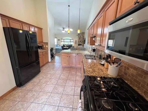 Spacious kitchen with gas stove and plentiful supplies!