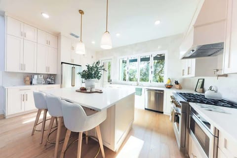 A chef’s dream kitchen Featuring a spacious island, premium appliances, and abundant natural light—this bright, modern space is perfect for cooking, snacking, or sipping morning coffee with a view.
