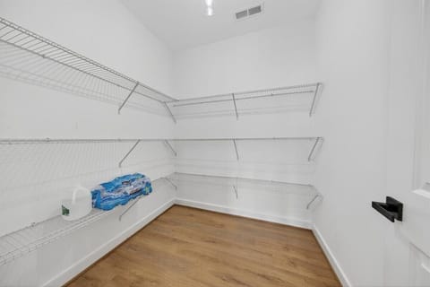 Plenty of space for vacation snacks, drinks, and easy organization in the oversized walk-in pantry.