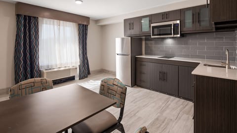 Suite, 2 Queen Beds, Non Smoking, Kitchenette | Desk, laptop workspace, blackout drapes, iron/ironing board