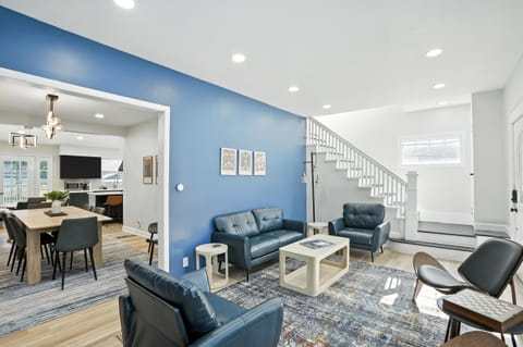 Open-concept living and dining with stylish flow, comfy seating, and a peek into the modern kitchen—perfect for hosting and hanging out!