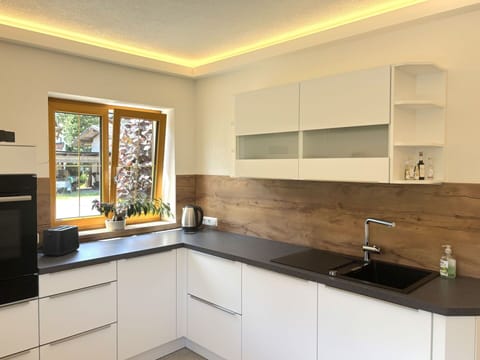 Flooring, Interior Design, Wood, Countertop, Kitchen, Floor, Kitchen Appliance, Cabinetry, Ceiling, Home