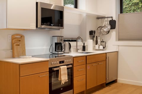 Full kitchen with everything you need to make a meal or simply enjoy morning coffee. 
*no dishwasher or freezer