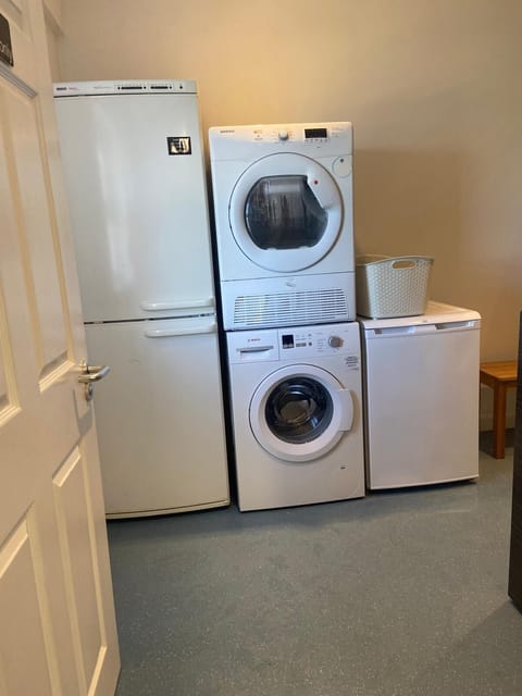 Utility Room has large fridge freezer, washing machine & tumble dryer for guests