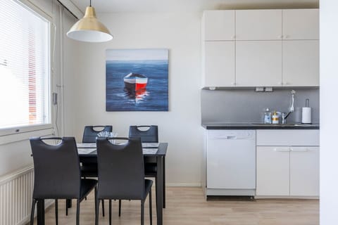 Dining Room: Gather round the stylish table and enjoy meals with a stunning boat-themed backdrop!