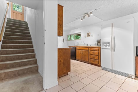 The downstairs studio kitchenette has a refrigerator, sink, coffee maker, microwave and cupboards.