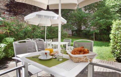 Enjoy an al fresco breakfast or snack on the garden terrace — buffet breakfast is available for an additional fee.