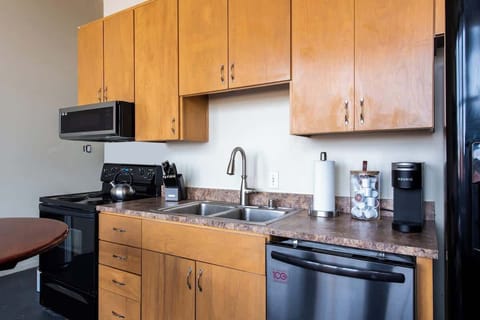 Kitchen 1 is fully stocked, including a Keurig with assorted coffee cups.
This kitchen has also been updated with stainless steel smart appliances after this picture was taken.