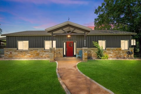 The front of the home showcases the perfect blend of modern elegance and rustic charm, inviting you to explore more.