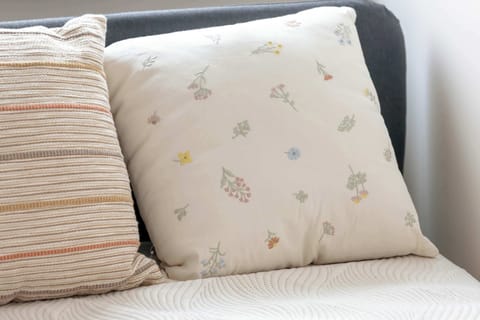 Close-up of patterned pillows on the sofa for a cozy feel.