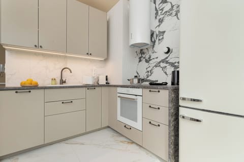 Bright kitchenette with oven.