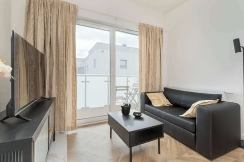 Living room with a comfortable sofa and TV.