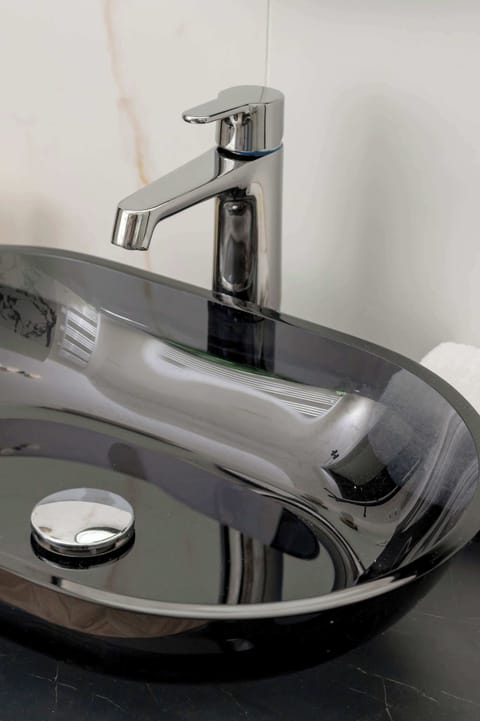 Black washbasin in the bathroom.