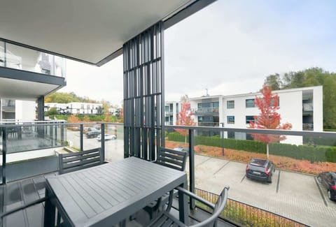 A private balcony with modern furniture, ideal for outdoor relaxation.